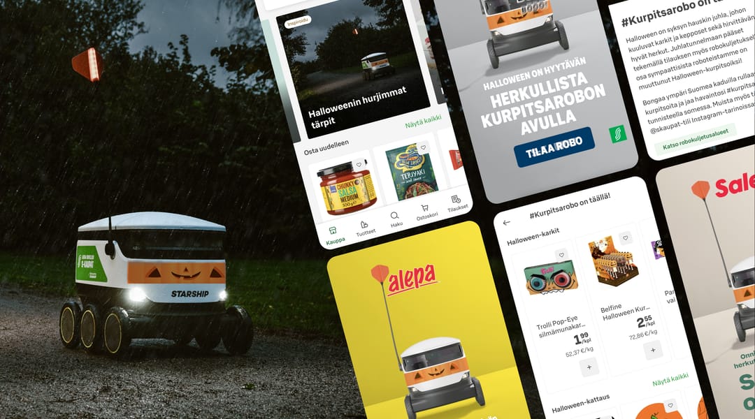 A halloween-themed Starship robot with a happy pumpkin-carving facepaint delivering an S-kaupat grocery order in the rain